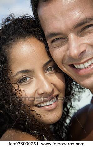 Couple cheek to cheek outdoors, portrait View Large Photo Image Stock Image - Couple cheek to cheek outdoors, portrait. Fotosearch