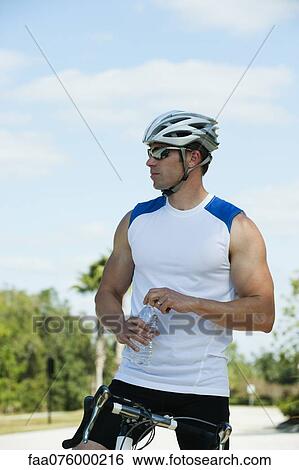 Cyclist taking break View Large Photo Image Stock Photograph - Cyclist taking break. Fotosearch