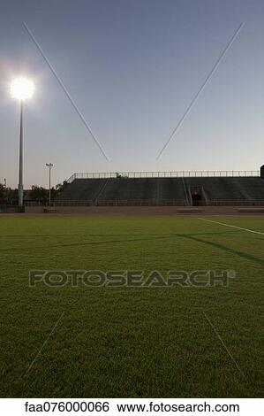 Stock Photograph - Empty sports field and stadium. Fotosearch