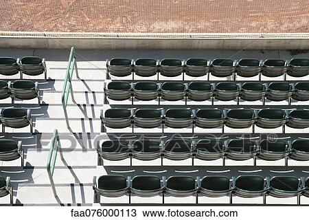 Stock Image - Empty stadium seats, overhead view. Fotosearch