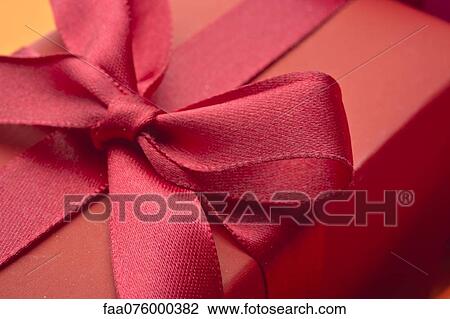 Festively wrapped gift, close-up View Large Photo Image Stock Image - Festively wrapped gift, close-up. Fotosearch