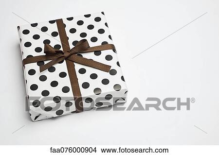 Festively wrapped gift View Large Photo Image Picture - Festively wrapped gift. Fotosearch