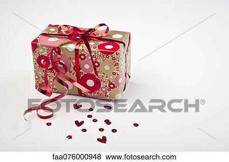 Festively wrapped gift View Large Photo Image Stock Photo - Festively wrapped gift. Fotosearch
