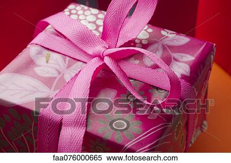 Festively wrapped gift View Large Photo Image Stock Photography - Festively wrapped gift. Fotosearch