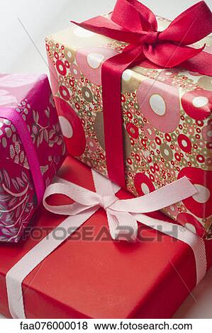 Festively wrapped gifts View Large Photo Image Stock Photo - Festively wrapped gifts. Fotosearch