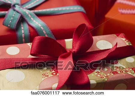 Festively wrapped gifts View Large Photo Image Stock Photo - Festively wrapped gifts. Fotosearch