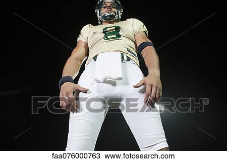 Stock Image - Football player, low angle view. Fotosearch