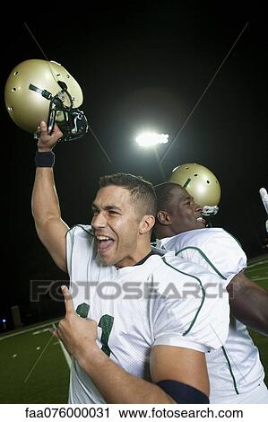 Stock Image - Football players celebrating victory. Fotosearch