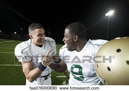 Football players celebrating victory together View Large Photo Image Stock Image - Football players celebrating victory together. Fotosearch