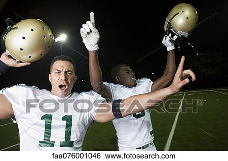 Stock Photograph - Football players celebrating victory. Fotosearch