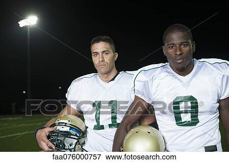 Stock Photo - Football players, portrait. Fotosearch