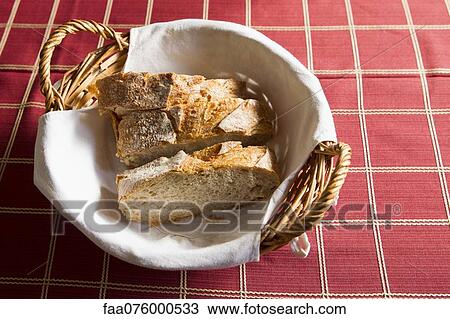 Stock Image - Fresh bread in basket. Fotosearch