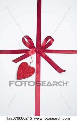 Gift decorated with ribbon and heart View Large Photo Image Stock Photography - Gift decorated with ribbon and heart. Fotosearch