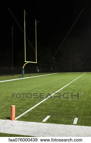 Goal post on empty football field View Large Photo Image Stock Photo - Goal post on empty football field. Fotosearch