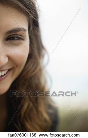 Stock Photo - Half of young woman's face. Fotosearch