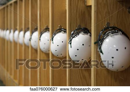 Helmets hanging in locker room View Large Photo Image Stock Photo - Helmets hanging in locker room. Fotosearch