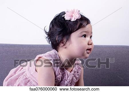 Infant girl looking away View Large Photo Image Stock Image - Infant girl looking away. Fotosearch