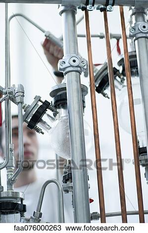 Man working with laboratory equipment View Large Photo Image Stock Image - Man working with laboratory equipment. Fotosearch