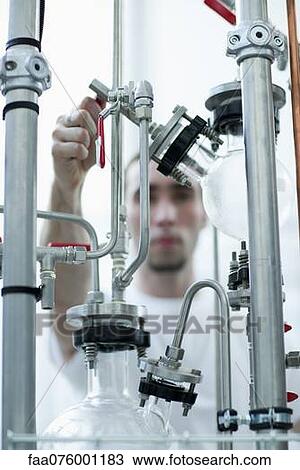 Man working with laboratory equipment View Large Photo Image Stock Image - Man working with laboratory equipment. Fotosearch