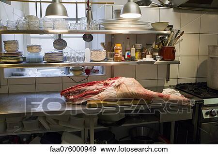 Pork leg on commercial kitchen counter View Large Photo Image Stock Photo - Pork leg on commercial kitchen counter. Fotosearch