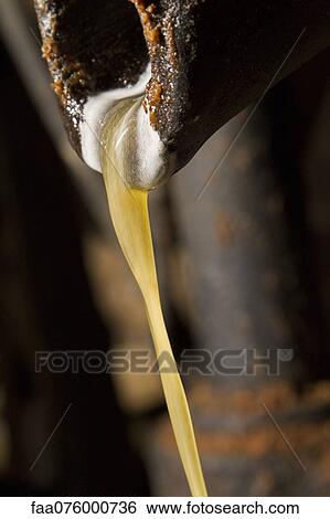 Stock Photograph - Pouring oil. Fotosearch