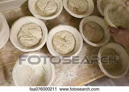 Stock Image - Preparing bread dough. Fotosearch