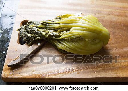 Preparing mustard greens View Large Photo Image Stock Image - Preparing mustard greens. Fotosearch