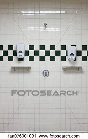 Public shower room with soap dispensers on wall View Large Photo Image Stock Image - Public shower room with soap dispensers on wall. Fotosearch