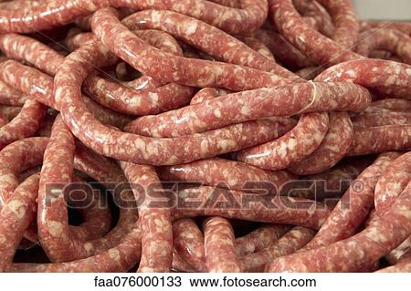 Stock Image - Raw, fresh sausage, full frame. Fotosearch