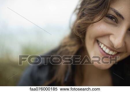 Stock Photography - Smiling young woman, cropped. Fotosearch