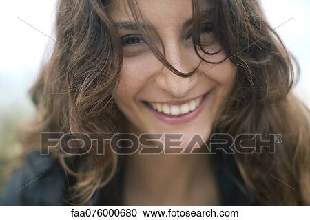 Stock Image - Smiling young woman. Fotosearch