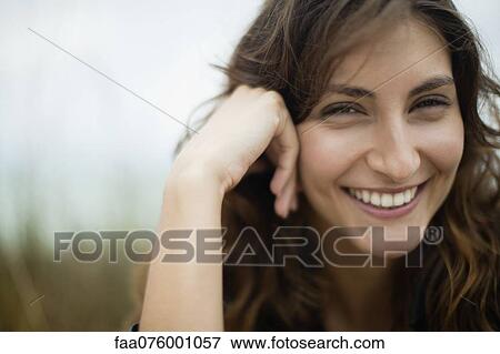 Stock Photo - Smiling young woman. Fotosearch