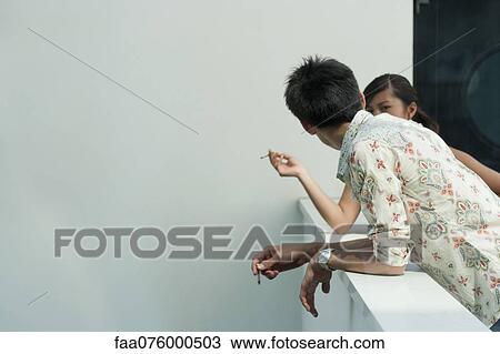 Smokers taking a cigarette break View Large Photo Image Stock Image - Smokers taking a cigarette break. Fotosearch