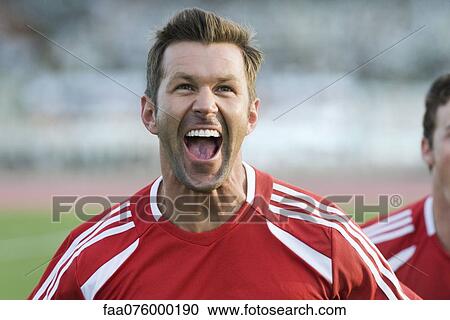 Stock Image - Soccer player cheering. Fotosearch