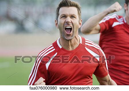 Soccer player cheering View Large Photo Image Stock Image - Soccer player cheering. Fotosearch