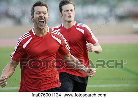 Picture - Soccer players cheering. Fotosearch
