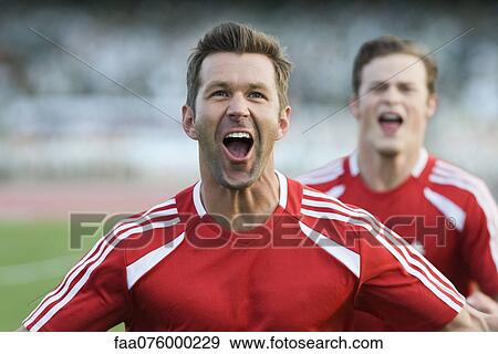 Stock Photo - Soccer players cheering. Fotosearch