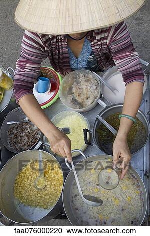 Stock Image - Street vendor serving food. Fotosearch