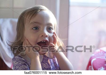 Toddler girl with mouth open in surprise View Large Photo Image Stock Photography - Toddler girl with mouth open in surprise. Fotosearch