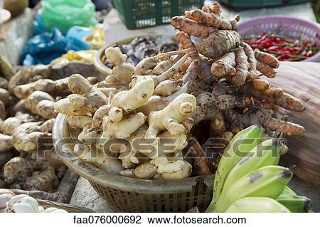 Stock Image - Varieties of ginger roots on market stall. Fotosearch