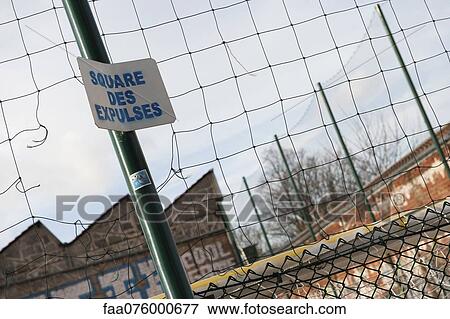 Wire fence with sign saying "square des expluses" View Large Photo Image Stock Photo - Wire fence with sign saying "square des expluses". Fotosearch