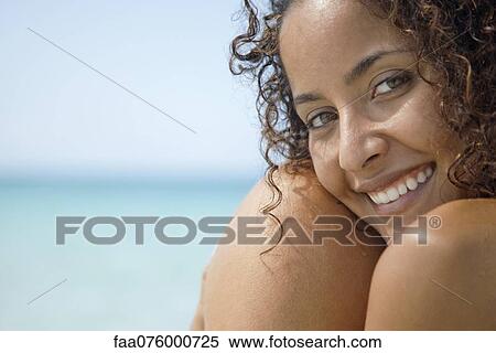 Woman at the beach, smiling, portrait View Large Photo Image Stock Photography - Woman at the beach, smiling, portrait. Fotosearch
