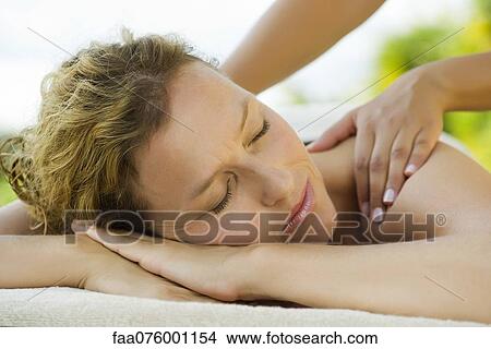Picture - Woman getting a massage at spa. Fotosearch