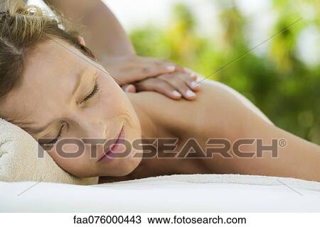 Woman getting a massage at spa View Large Photo Image Stock Image - Woman getting a massage at spa. Fotosearch