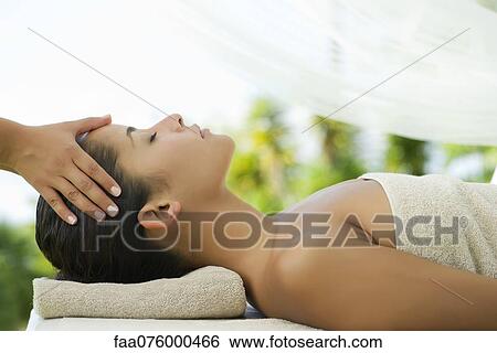 Woman getting a massage at spa View Large Photo Image Stock Photograph - Woman getting a massage at spa. Fotosearch