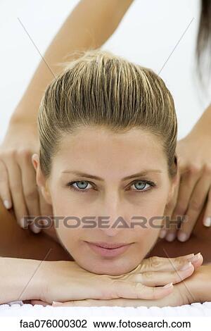 Stock Image - Woman getting a massage, portrait. Fotosearch