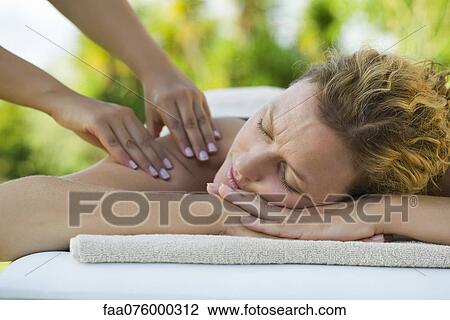 Stock Image - Woman getting a massage. Fotosearch