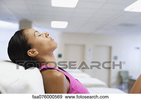 Woman relaxing with eyes closed View Large Photo Image Stock Photo - Woman relaxing with eyes closed. Fotosearch