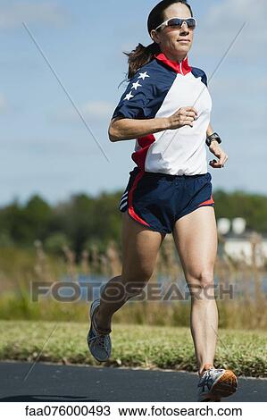 Woman running View Large Photo Image Stock Image - Woman running. Fotosearch