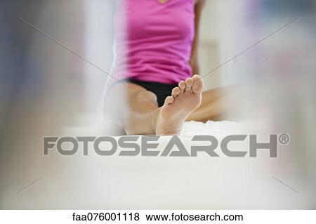 Woman sitting, cropped, low angle view View Large Photo Image Stock Photo - Woman sitting, cropped, low angle view. Fotosearch